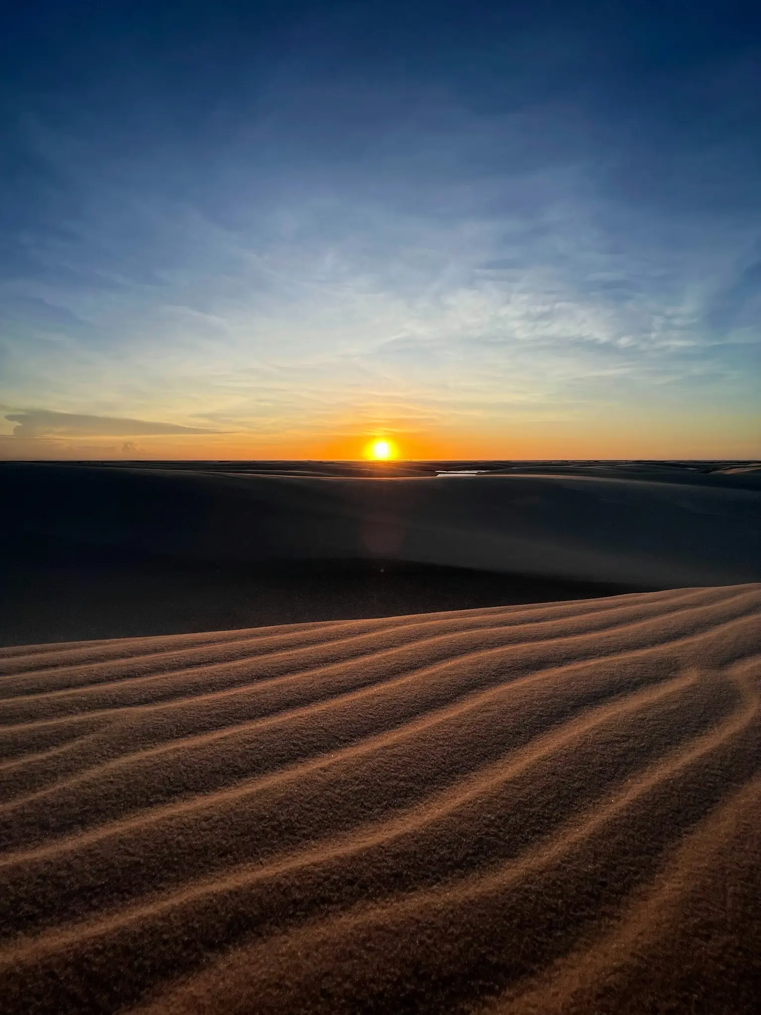 Quiet lagoon and sweeping dunes in Lençóis Maranhenses