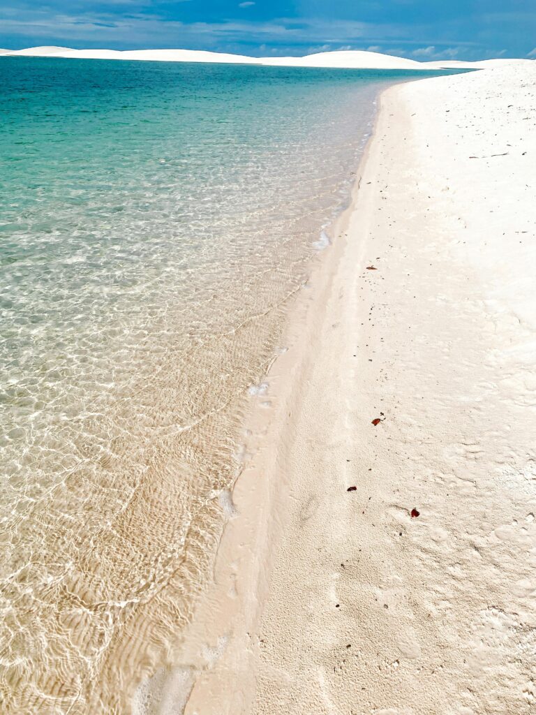 pexels-photo-27990196-27990196 Pristine tropical beach with turquoise water and white sand dunes, perfect for summer vacations.