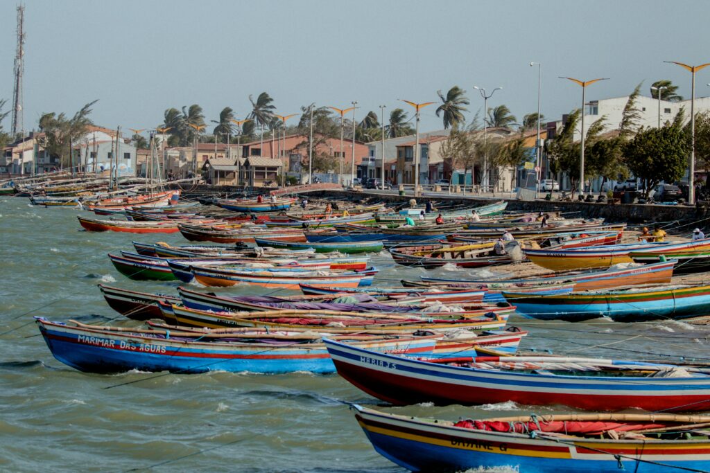 Vibrant fishing boats docked at Parnaíba pier, showcasing coastal life and local culture.